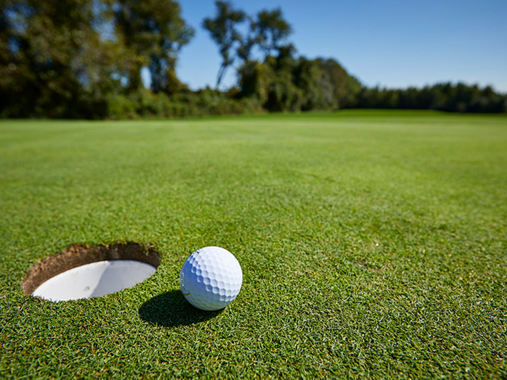 Golf ball near hole
